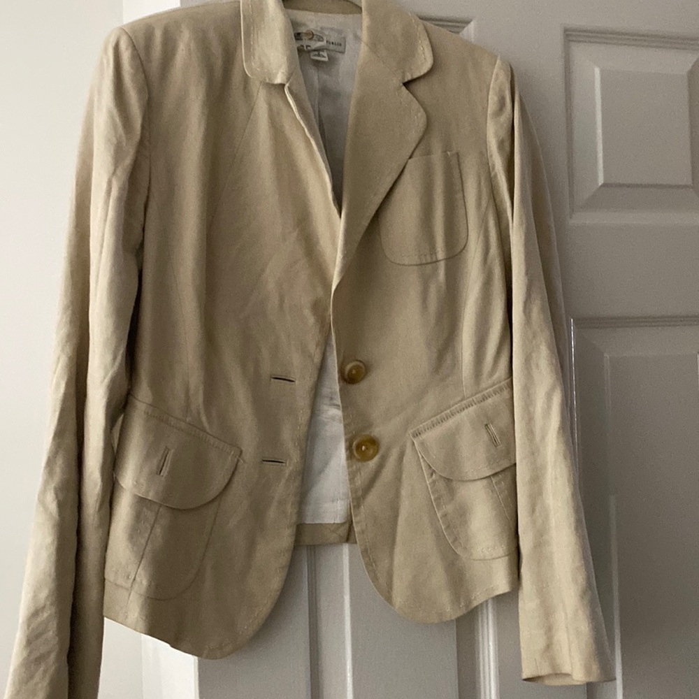 Ladies linen suit . Jacket is waist length and the matching pants are flat front